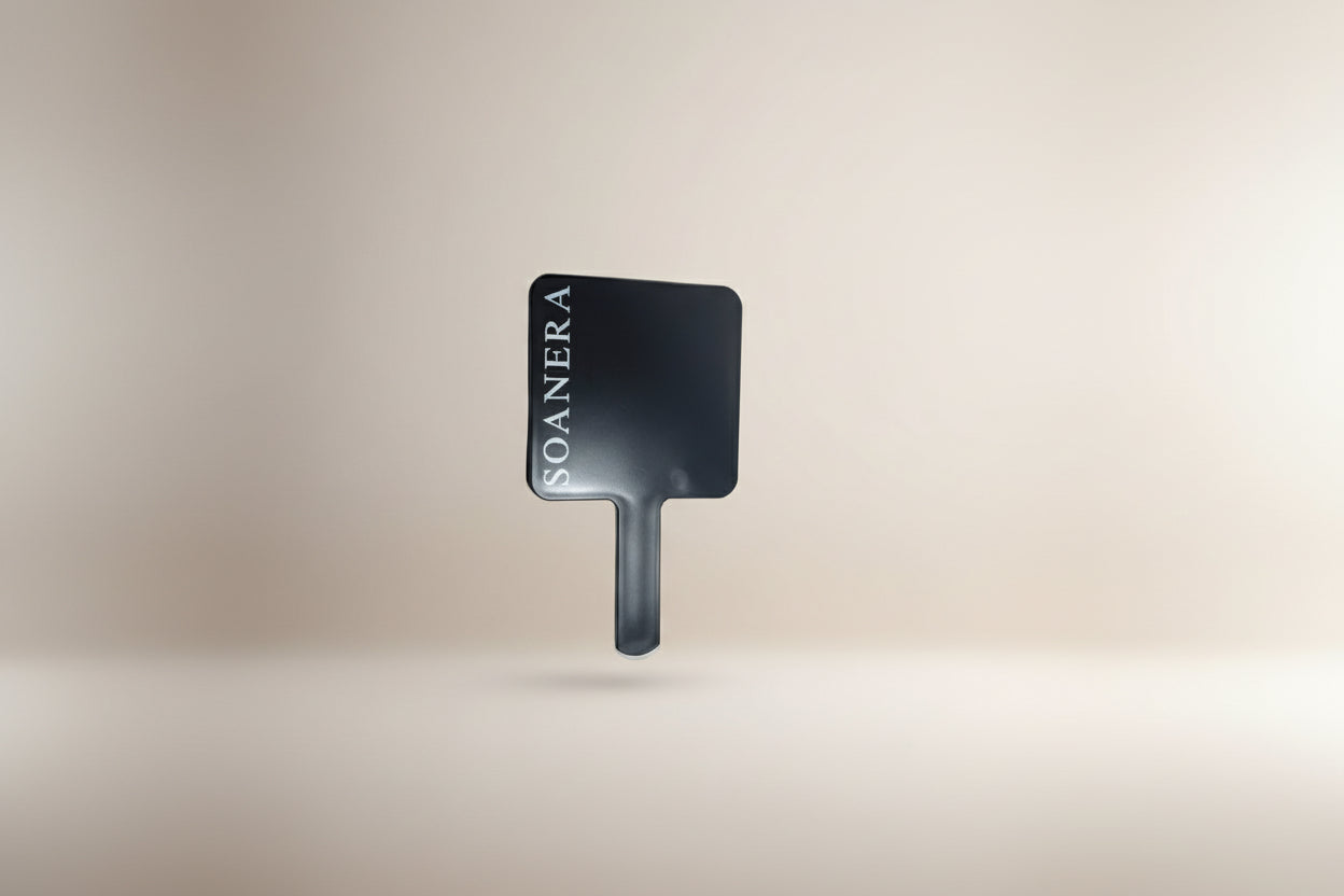 Black mirror with white logo on beige background